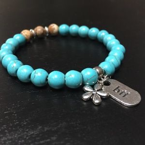 NATURAL TURQUOISE STONE BEADED BRACELET W/ANTIQUE SILVER CHARMS